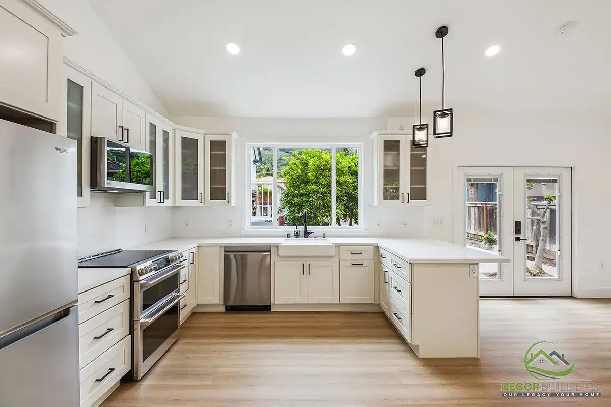 Custom kitchen remodel featuring white shaker cabinetry, stainless steel appliances, hardwood flooring, and pendant lighting in Morgan Hill, CA