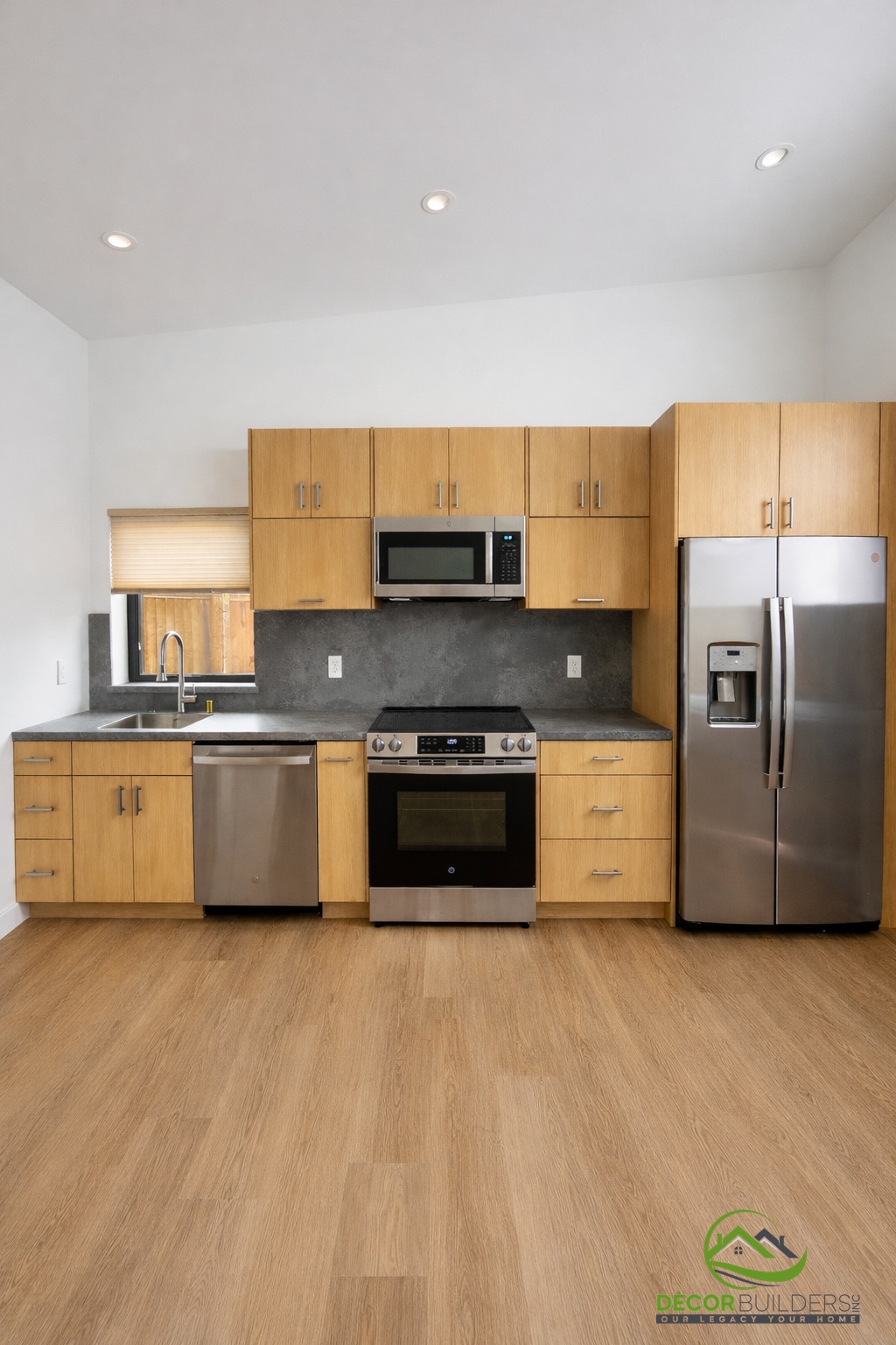 Custom home builders kitchen with wood cabinets and stainless steel appliances in Sunnyvale, CA