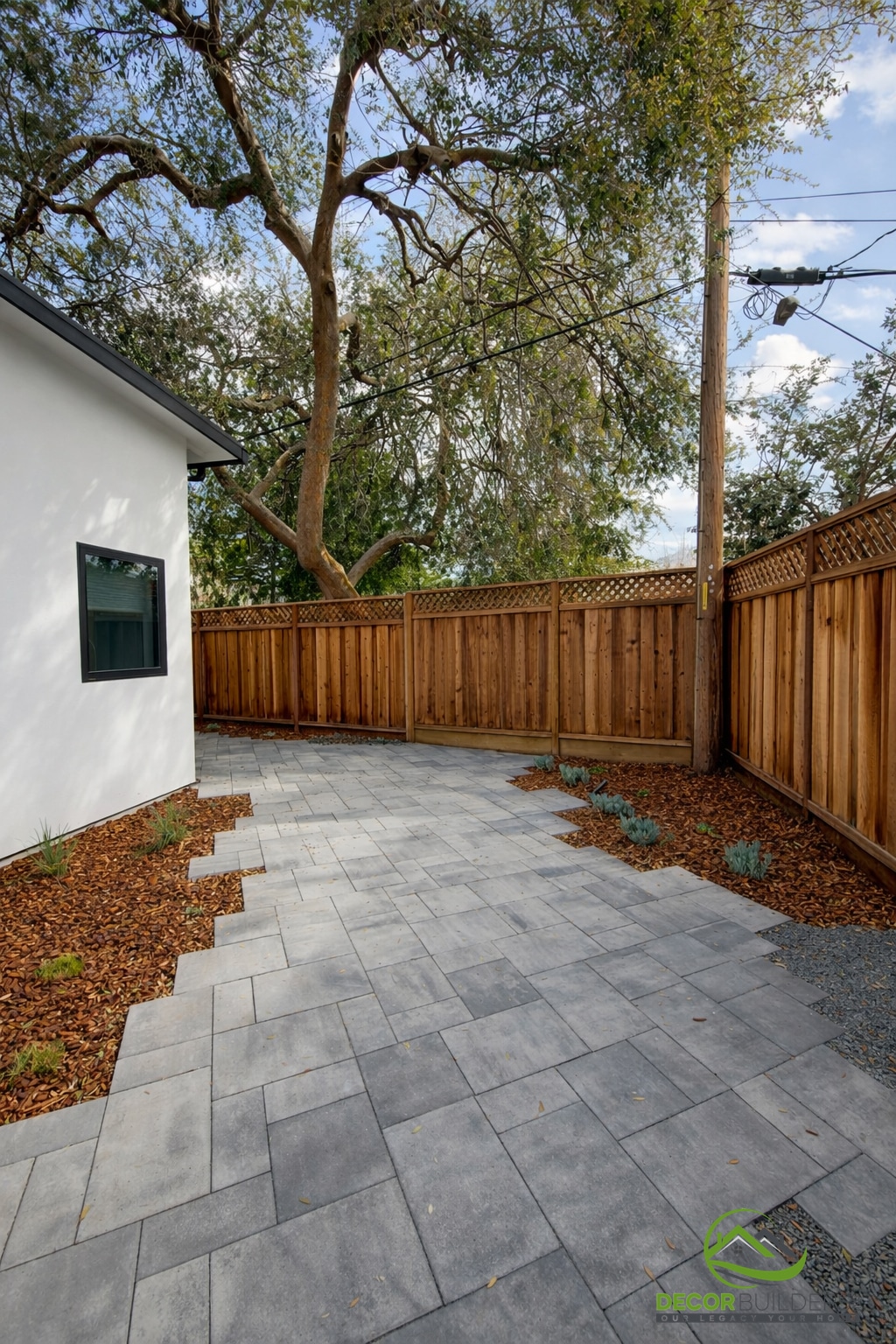 Hardscape design with gray paver patio and wood privacy fence, Sunnyvale CA