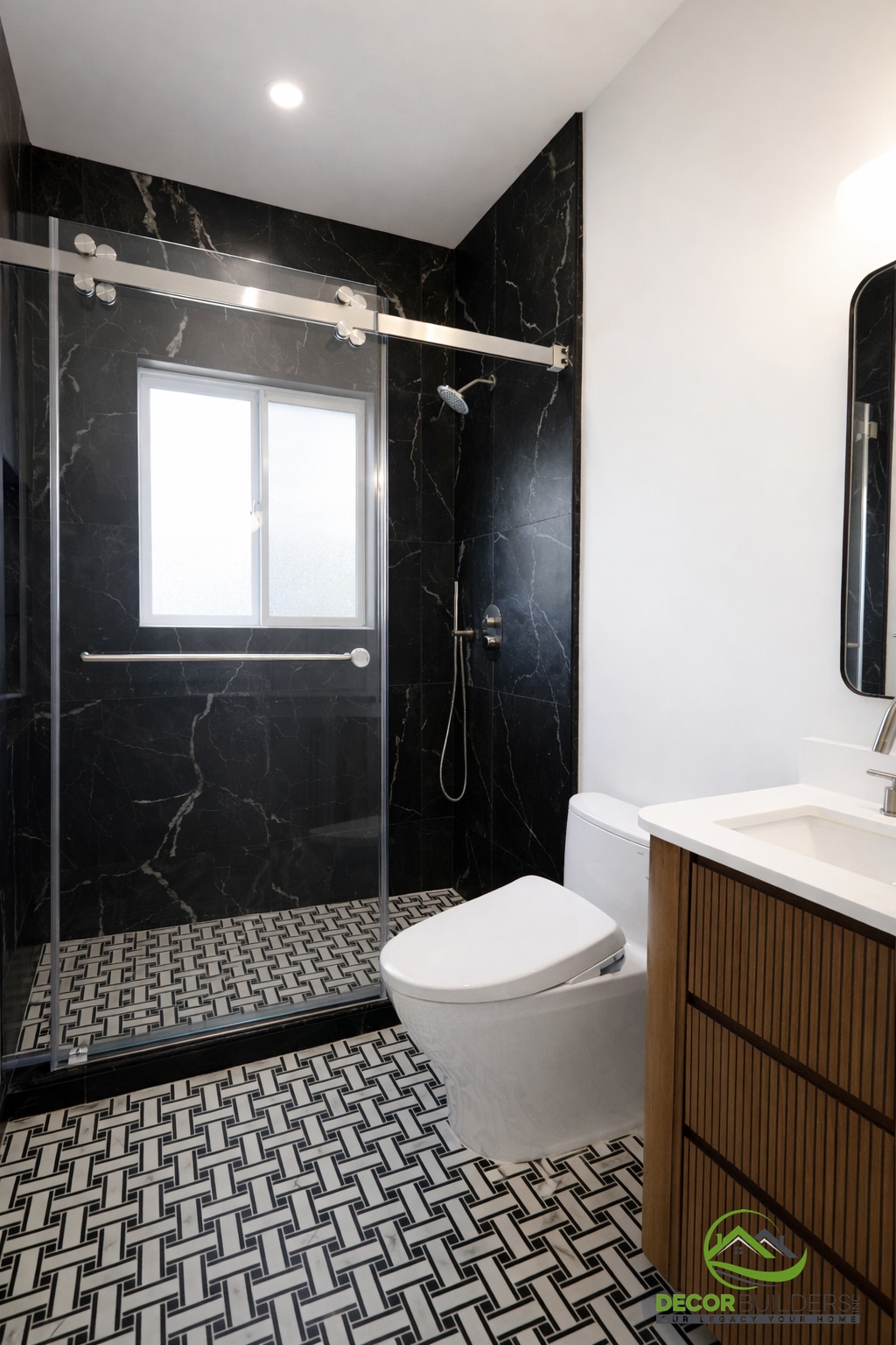 Custom bathroom remodel with black marble tile shower, barn-style sliding glass door, and mosaic tile flooring in Palo Alto