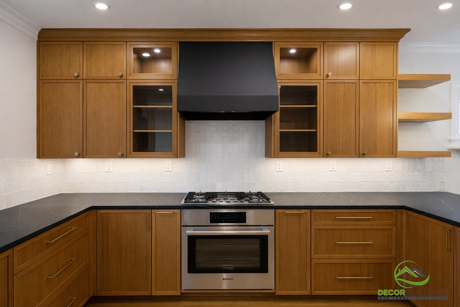 Custom kitchen renovation with warm wood upper and lower cabinets, built-in wall oven, and white subway tile backsplash in Palo Alto
