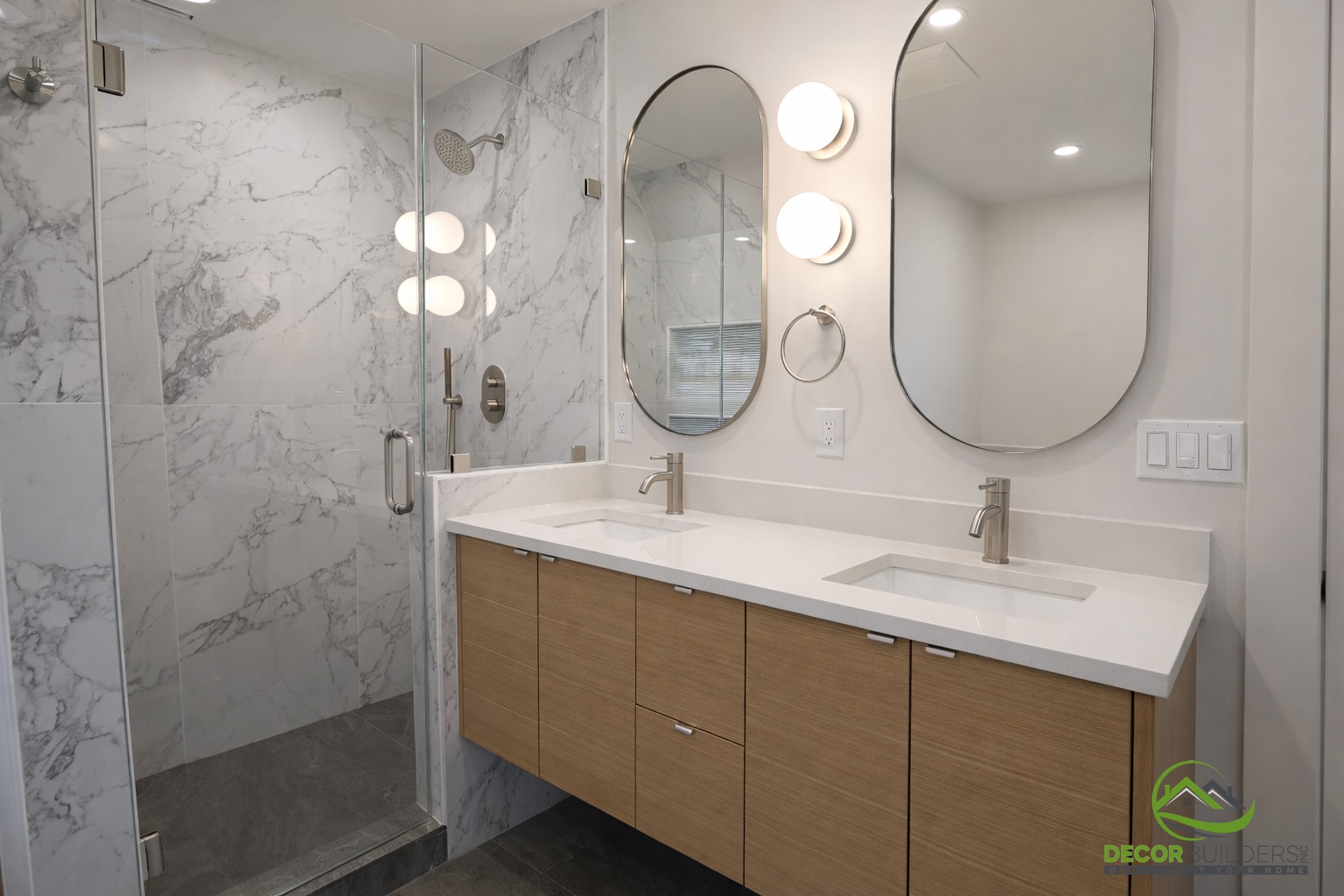 Bathroom remodel featuring a floating wood vanity, white undermount sink, oval mirror, and marble tile walls in Palo Alto