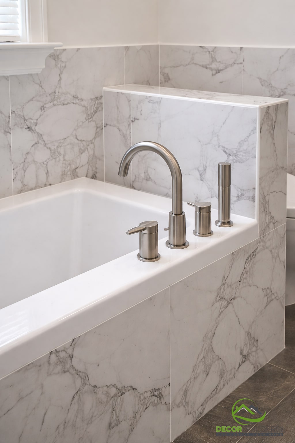 Luxury bathroom renovation featuring a freestanding soaking tub with brushed nickel faucet and white marble surround in Palo Alto