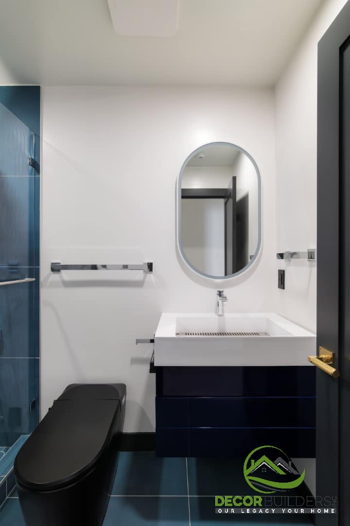 Bathroom with navy vanity, vessel sink, and oval mirror, a bathroom remodeling project in Campbell, CA