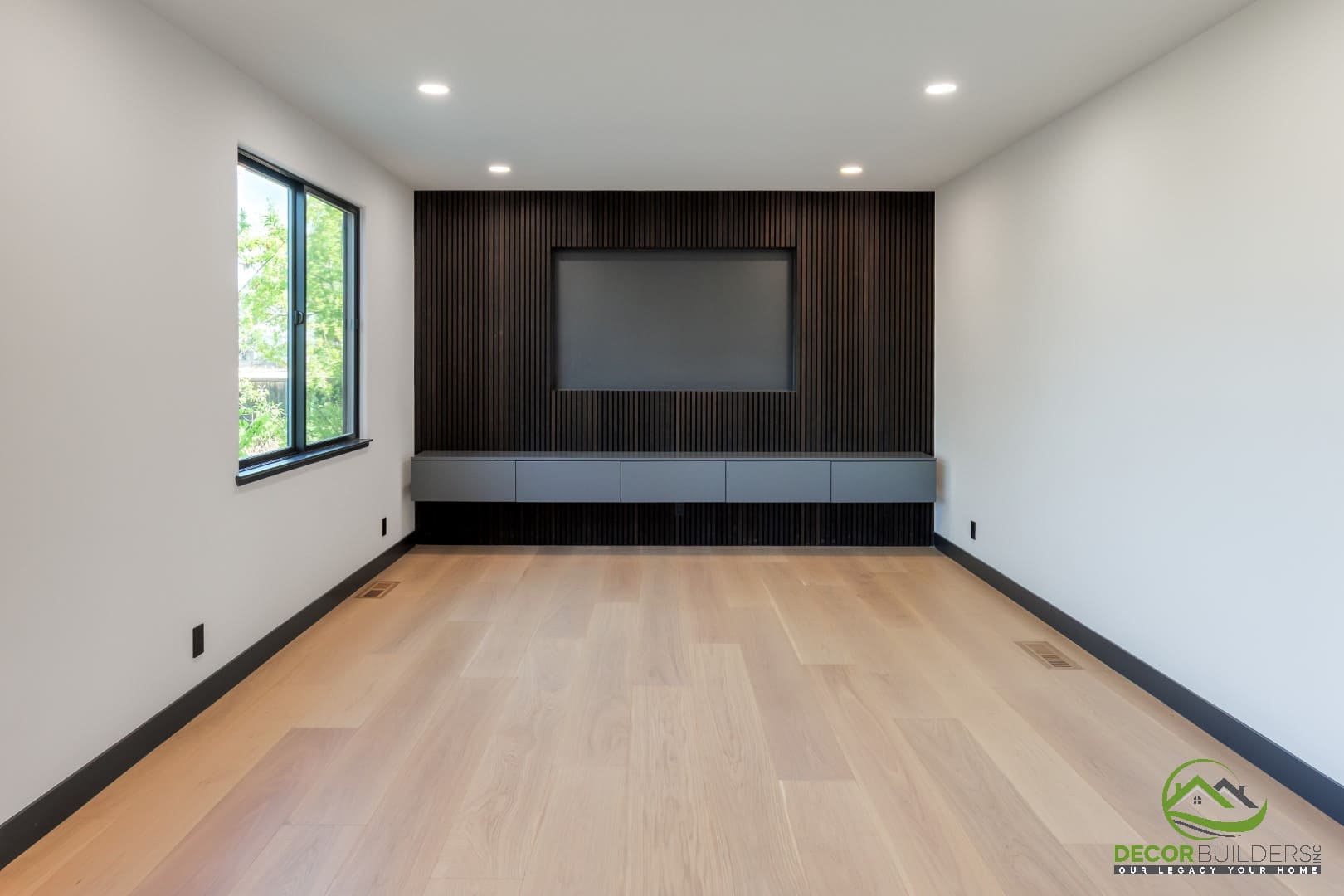 Open living area with vaulted ceiling and dark wood accent wall, part of a custom home design in Campbell, CA