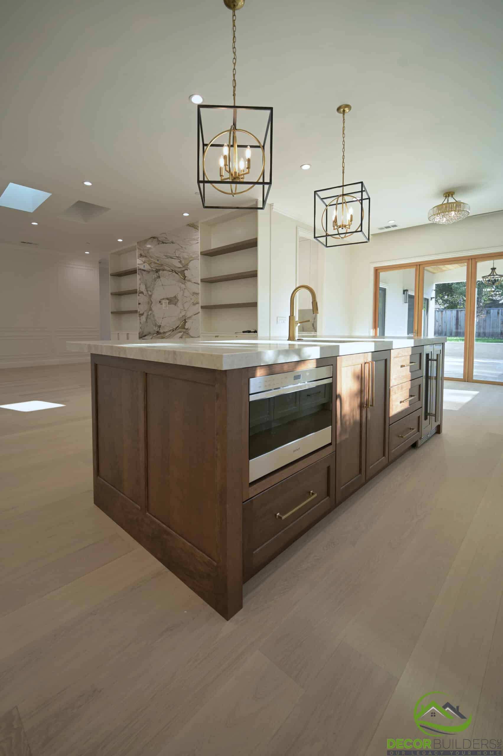 Custom kitchen island with built-in appliances and open shelving from a kitchen remodel in Cupertino, CA