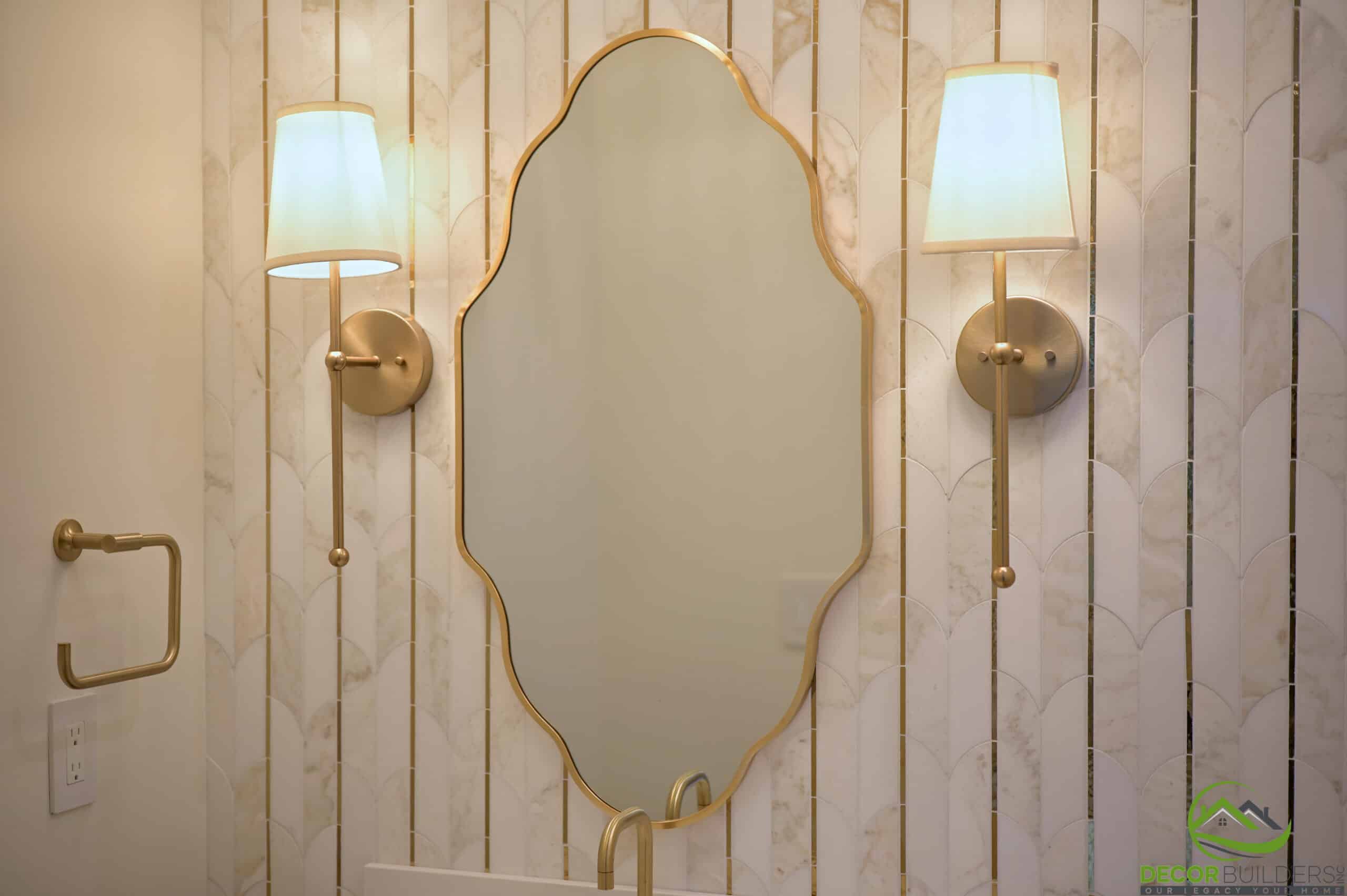 Powder room vanity with ornate mirror and wall sconces, a custom bathroom remodeling detail in Cupertino, CA