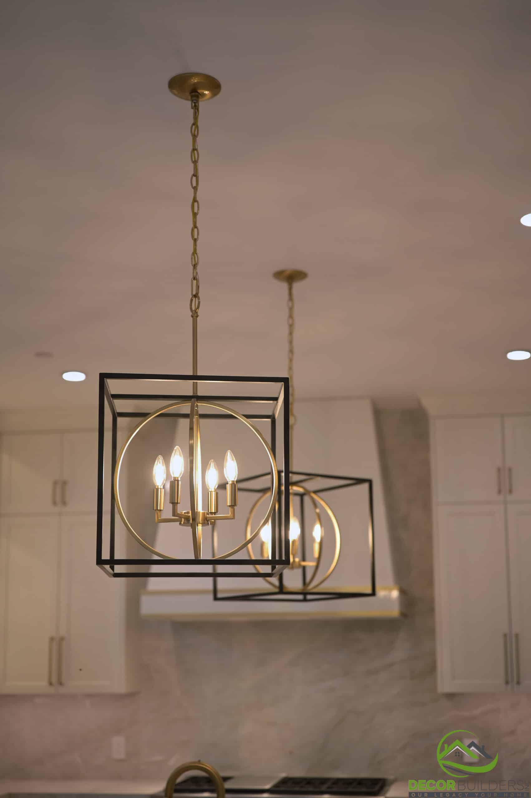Modern geometric pendant lighting above a kitchen island, a kitchen remodeling detail in Cupertino, CA