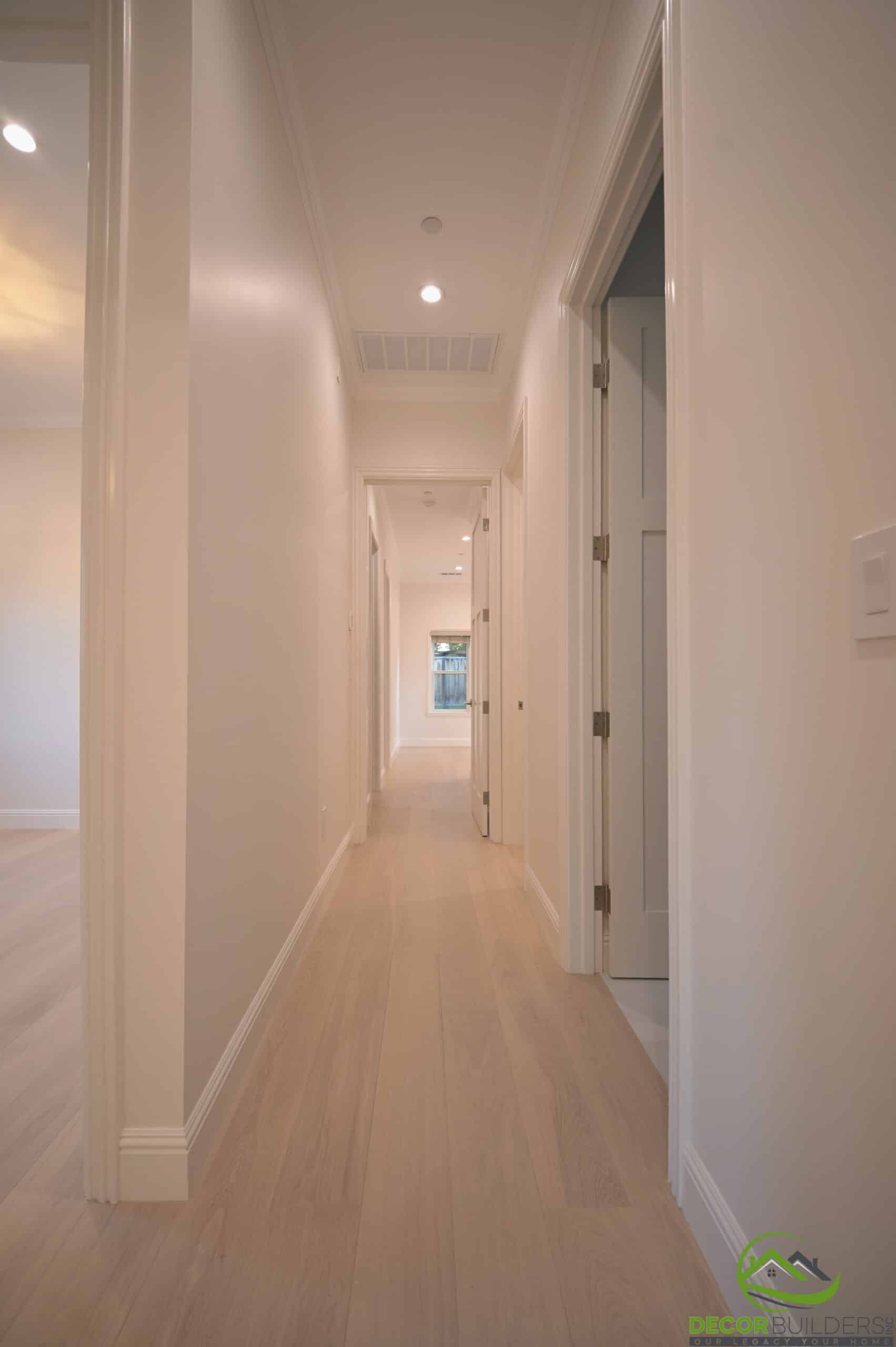 Hallway with hardwood flooring from a custom home remodel in Cupertino, CA