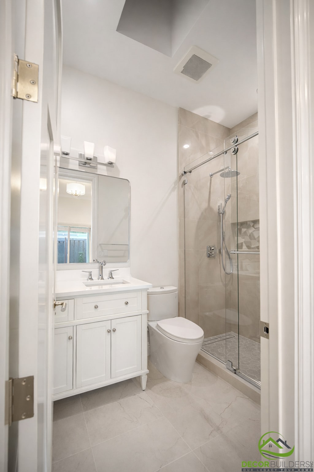 Bathroom with vanity, toilet, and glass shower door, part of a bathroom renovation in Cupertino, CA