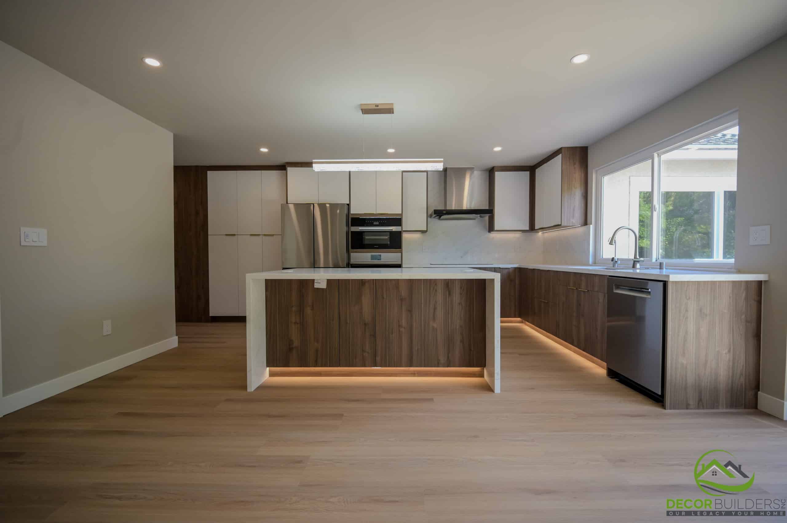 Custom home construction kitchen with wood island, stainless appliances, and recessed lighting, Foster City CA