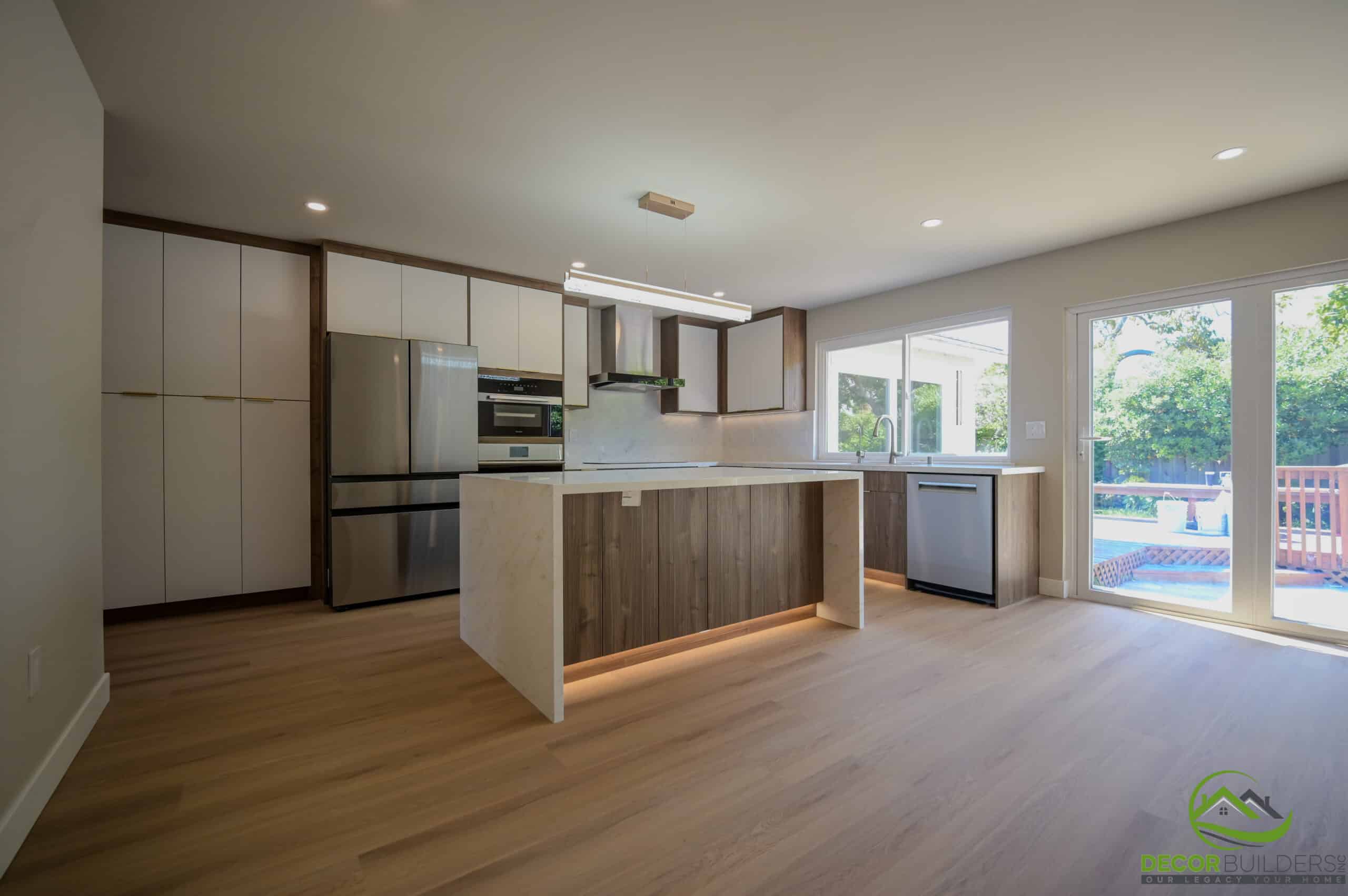 Home remodeling open kitchen with wood island, stainless refrigerator, and sliding glass door, Foster City CA
