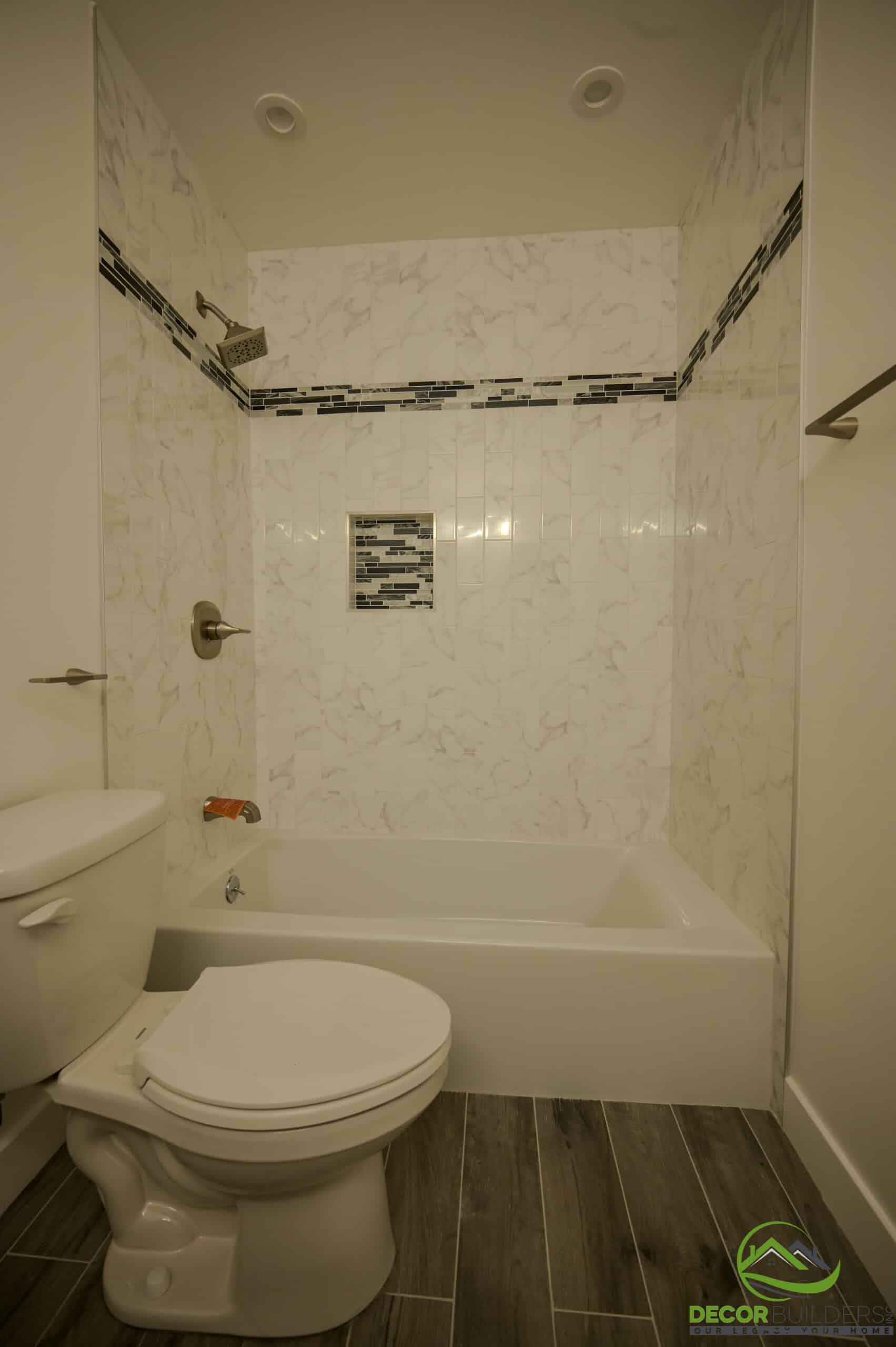 Bath remodeling tub and shower combo with marble tile, mosaic accent border, and wood floor tile, Foster City CA