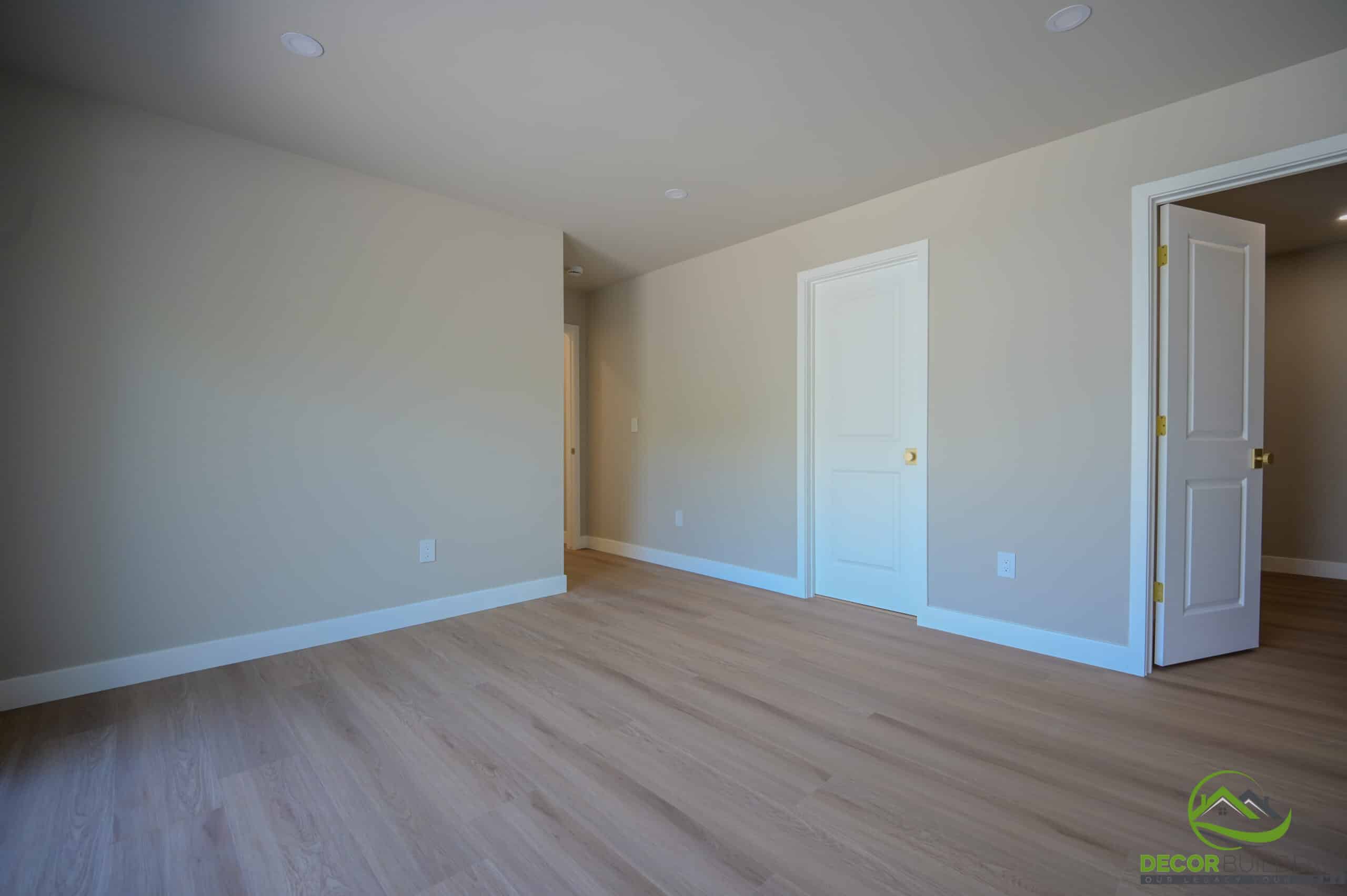Building a custom home bedroom with hardwood floors, recessed lighting, and double door entry, Foster City CA