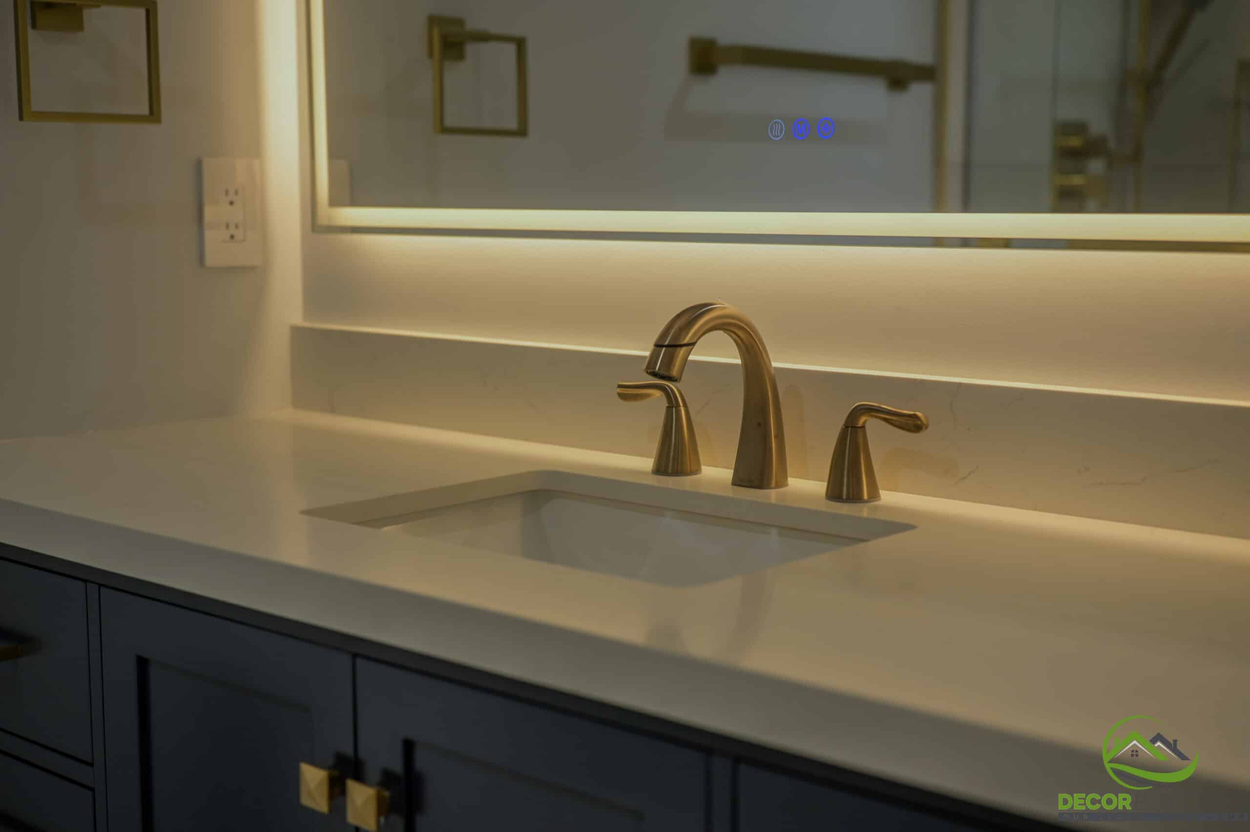 Bathroom remodel close-up with undermount sink, brushed gold faucet, and backlit mirror, Foster City CA