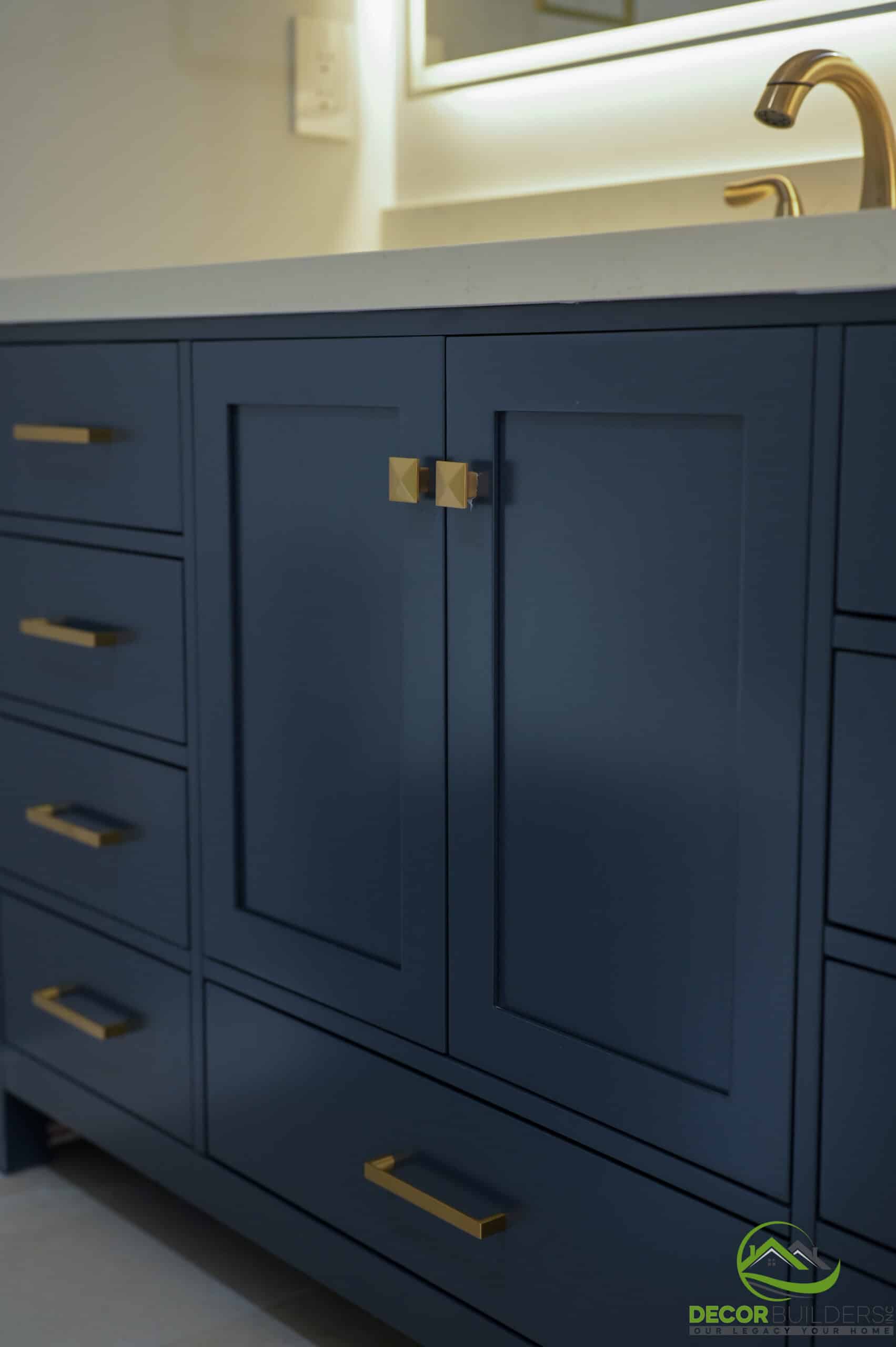 Custom home bathroom navy shaker cabinet with gold drawer pulls and quartz countertop, Foster City CA