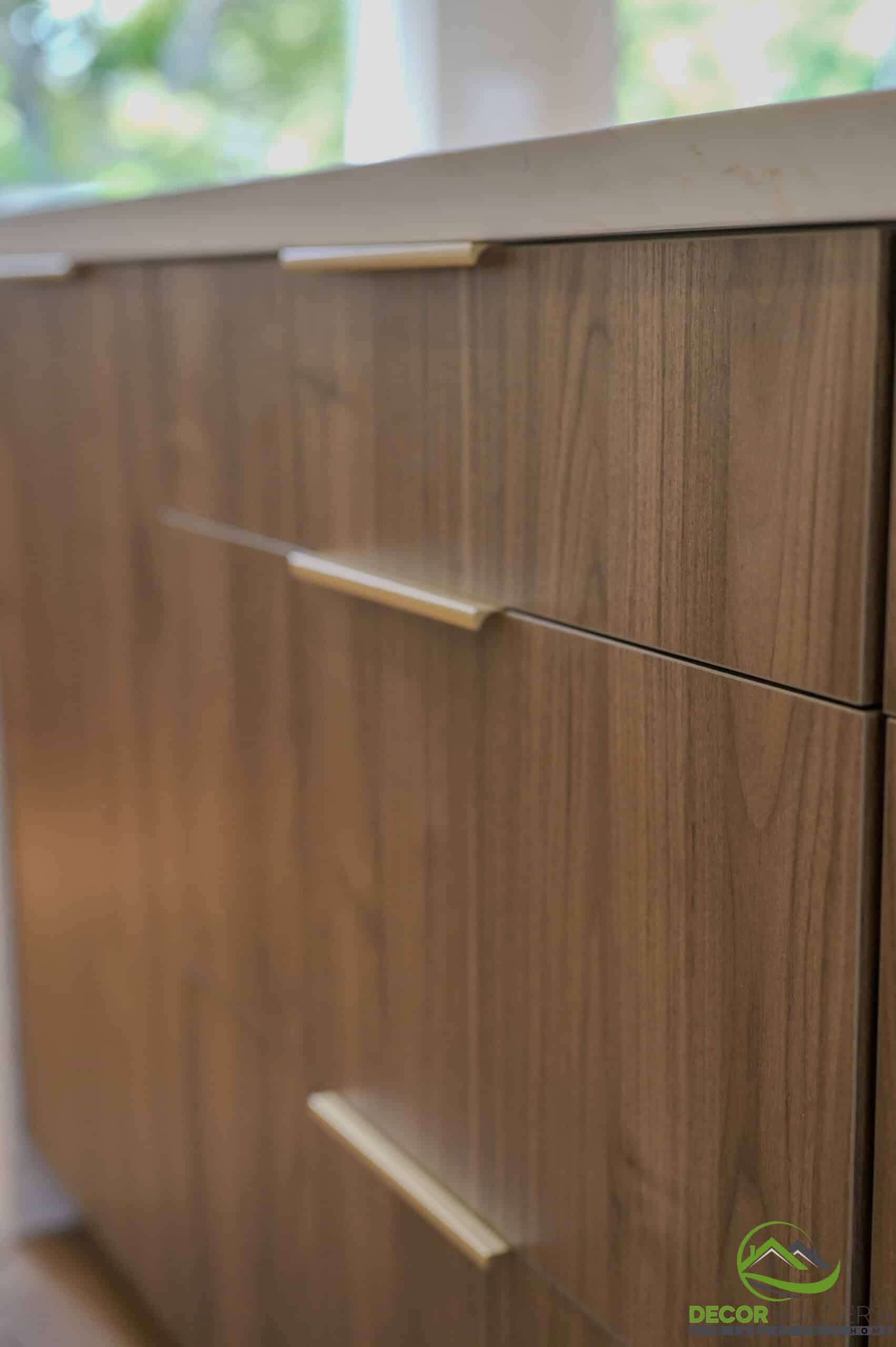 Custom home bathroom floating wood vanity close-up with gold bar pulls and quartz countertop, Foster City CA